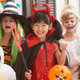 Group of children dressed up in costumes for Halloween